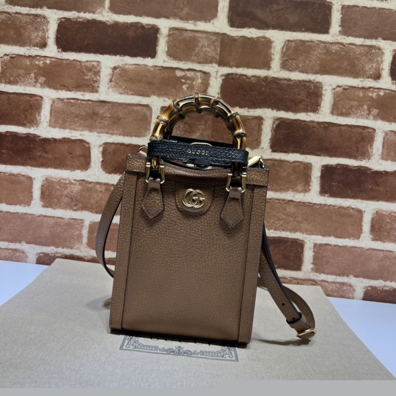 G*u*i top handle bags